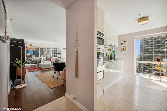 100 E Huron St Unit 1806, Chicago, IL 60611 - hallway with light tile patterned floors and baseboards