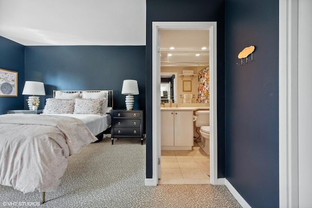 100 E Huron St Unit 1806, Chicago, IL 60611 - carpeted bedroom featuring tile patterned floors, recessed lighting, ensuite bathroom, and baseboards