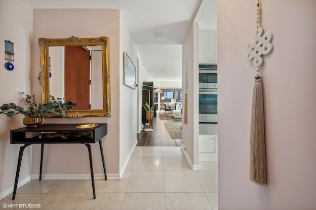 100 E Huron St Unit 1806, Chicago, IL 60611 - hallway featuring baseboards and light tile patterned floors