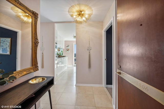100 E Huron St Unit 1806, Chicago, IL 60611 - hall featuring baseboards and light tile patterned floors
