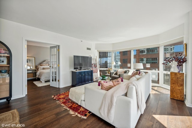 100 E Huron St Unit 1806, Chicago, IL 60611 - living room with dark wood-style flooring, french doors, and arched walkways