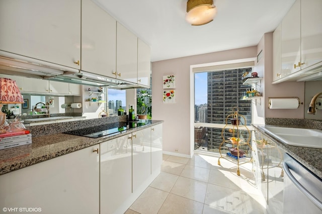 100 E Huron St Unit 1806, Chicago, IL 60611 - kitchen with stainless steel dishwasher, black electric stovetop, a sink, and white cabinetry