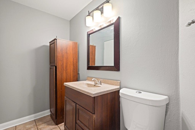 1637 S 48th Ct Unit 9, Cicero, IL 60804 - bathroom with vanity, toilet, tile patterned floors, and baseboards