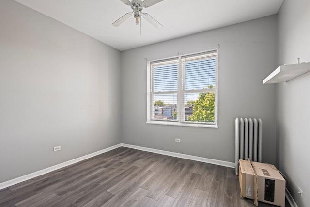 1637 S 48th Ct Unit 9, Cicero, IL 60804 - empty room with radiator heating unit, dark wood finished floors, ceiling fan, and baseboards
