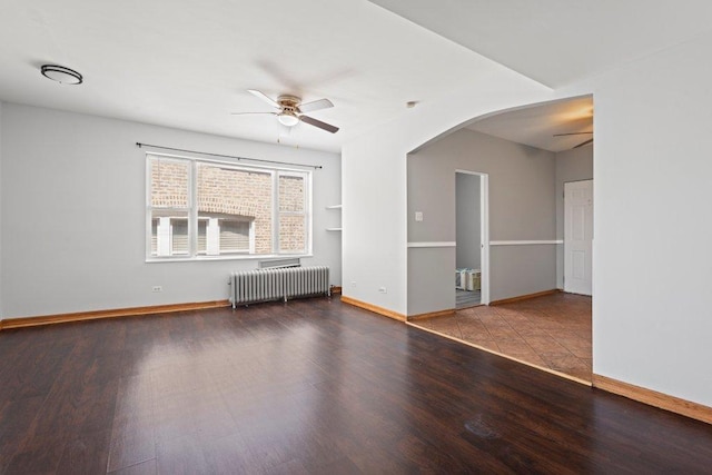 1637 S 48th Ct Unit 9, Cicero, IL 60804 - unfurnished living room with radiator, ceiling fan, arched walkways, and wood finished floors