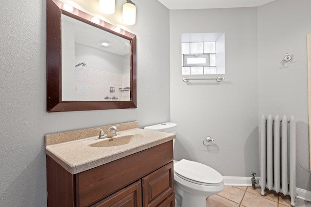 1637 S 48th Ct Unit 9, Cicero, IL 60804 - bathroom with radiator heating unit, toilet, tile patterned floors, vanity, and baseboards