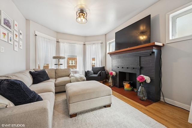 5830 N Glenwood Ave, Chicago, IL 60660 - living area with wood finished floors, healthy amount of natural light, and a fireplace