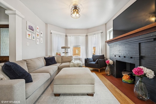 5830 N Glenwood Ave, Chicago, IL 60660 - living area featuring wood finished floors and a fireplace