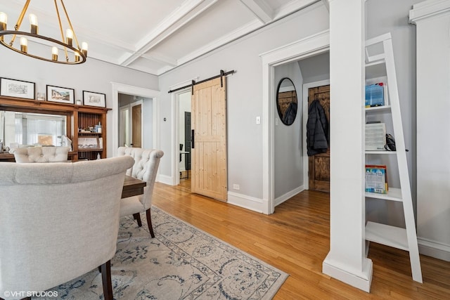5830 N Glenwood Ave, Chicago, IL 60660 - living room featuring coffered ceiling, a barn door, light wood-type flooring, a chandelier, and beam ceiling