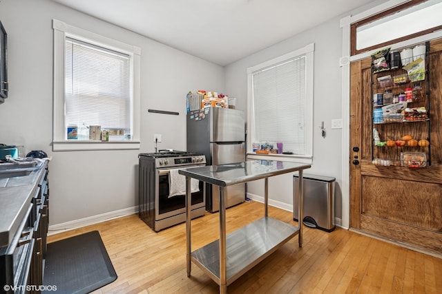 5830 N Glenwood Ave, Chicago, IL 60660 - kitchen with stainless steel appliances and light wood-type flooring