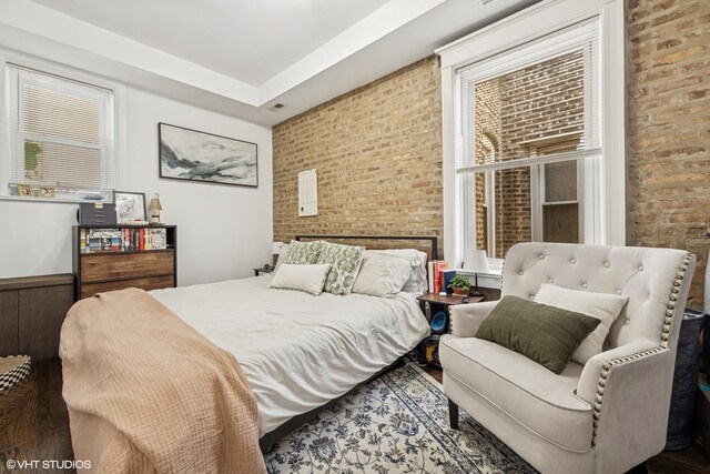 5830 N Glenwood Ave, Chicago, IL 60660 - bedroom featuring brick wall and wood finished floors