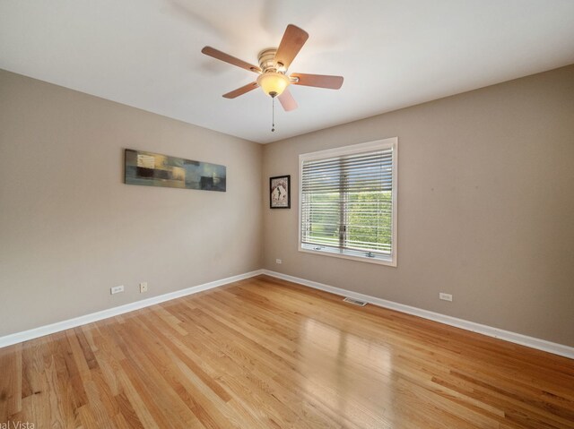 420 Ford Ln, Bartlett, IL 60103 - empty room with light wood-style flooring, baseboards, and a ceiling fan