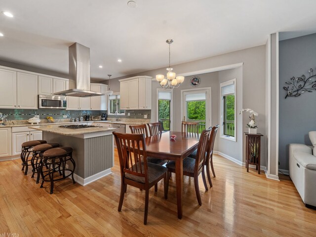 420 Ford Ln, Bartlett, IL 60103 - dining area with light wood-type flooring, recessed lighting, a chandelier, and baseboards