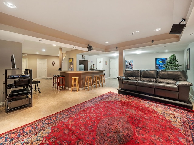 420 Ford Ln, Bartlett, IL 60103 - living room with bar with sink, recessed lighting, baseboards, and light tile patterned floors