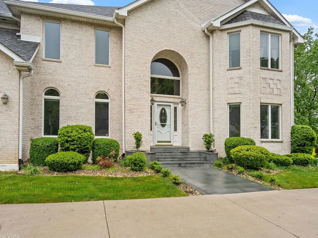 420 Ford Ln, Bartlett, IL 60103 - view of front facade featuring brick siding and a shingled roof