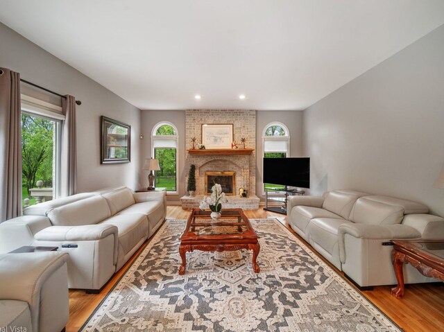 420 Ford Ln, Bartlett, IL 60103 - living room with healthy amount of natural light, light wood-style flooring, recessed lighting, and a fireplace