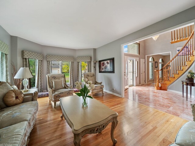 420 Ford Ln, Bartlett, IL 60103 - living room with stairs, wood finished floors, and baseboards