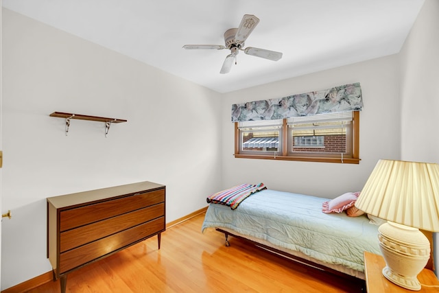 5112 N Oneida Ave, Norridge, IL 60706 - bedroom with light wood-style floors, ceiling fan, and baseboards