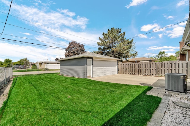5112 N Oneida Ave, Norridge, IL 60706 - view of yard featuring central AC unit, an outbuilding, and a detached garage
