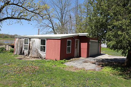 1803 Orchard Ln, Mchenry, IL 60050 - view of outdoor structure featuring a garage and driveway