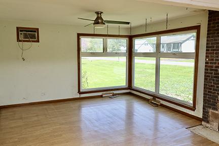 1803 Orchard Ln, Mchenry, IL 60050 - unfurnished dining area with a wall mounted air conditioner, a ceiling fan, baseboards, and healthy amount of natural light