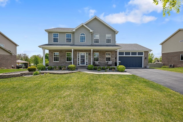 2274 Scotsglen Dr, New Lenox, IL 60451 - view of front of house featuring driveway, brick siding, a porch, and a front lawn
