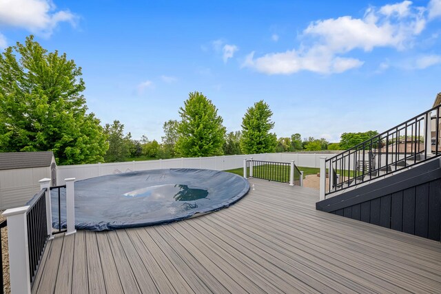 2274 Scotsglen Dr, New Lenox, IL 60451 - deck with fence, a storage unit, an outbuilding, stairs, and a jacuzzi