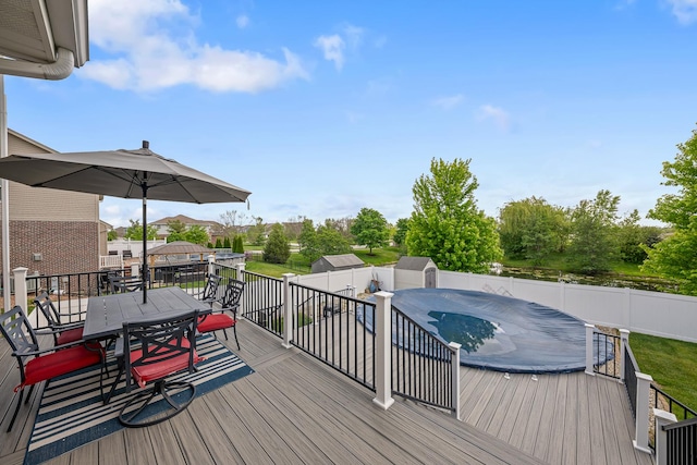 2274 Scotsglen Dr, New Lenox, IL 60451 - deck with outdoor dining space, a fenced backyard, and a jacuzzi