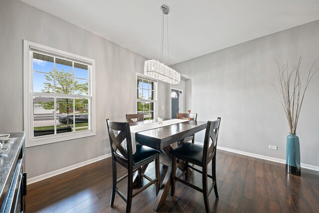 2274 Scotsglen Dr, New Lenox, IL 60451 - dining area featuring baseboards, dark wood-style flooring, and a chandelier