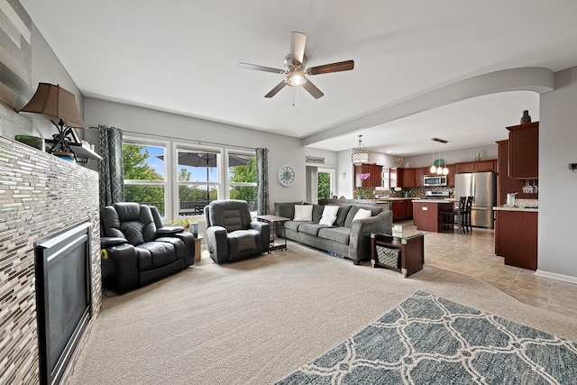 2274 Scotsglen Dr, New Lenox, IL 60451 - living room with ceiling fan, a glass covered fireplace, and light colored carpet