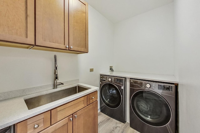 2028 Valor Ct, Glenview, IL 60026 - laundry room with washer and clothes dryer, cabinet space, and light wood-type flooring