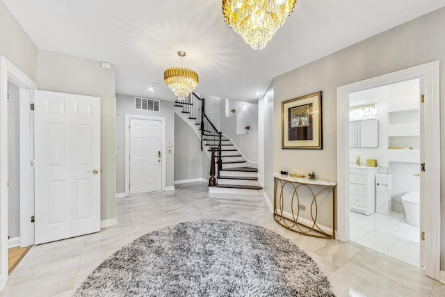 2028 Valor Ct, Glenview, IL 60026 - foyer featuring a chandelier, marble finish flooring, stairs, and baseboards