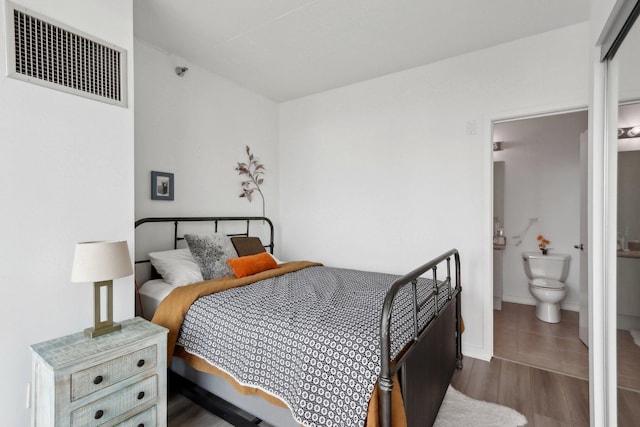 611 S Wells St Unit 2801, Chicago, IL 60607 - bedroom with wood finished floors, baseboards, and ensuite bath