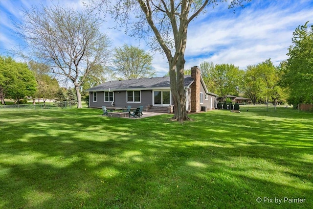 back of property featuring a chimney, a patio, and cooling unit