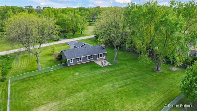 view from above of property with a heavily wooded area