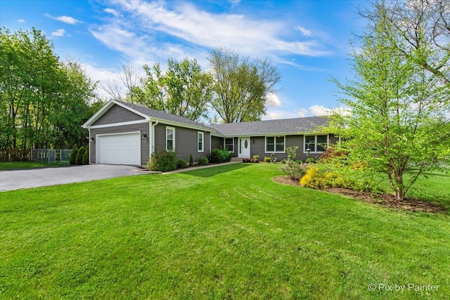 ranch-style house with asphalt driveway and a garage