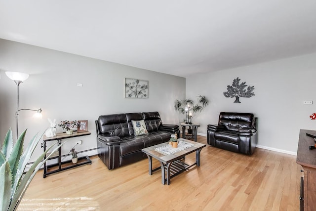 living area featuring light wood-style flooring and baseboards