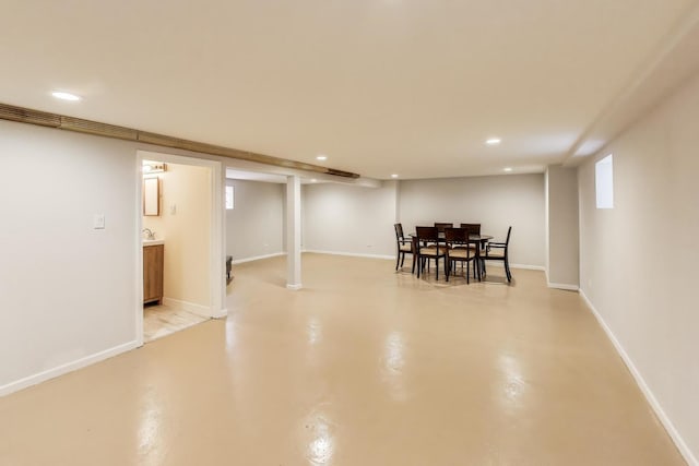 dining room featuring recessed lighting, concrete floors, and baseboards