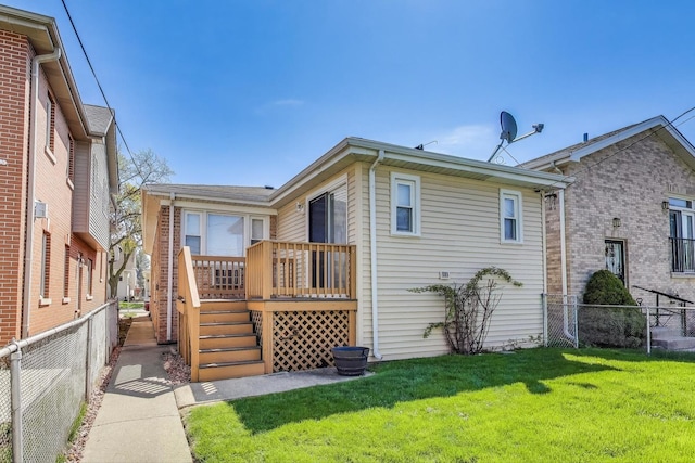 rear view of property featuring a deck