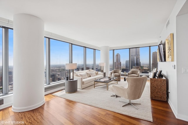 60 E Monroe St Unit 6203, Chicago, IL 60603 - living area featuring wood finished floors, plenty of natural light, and baseboards