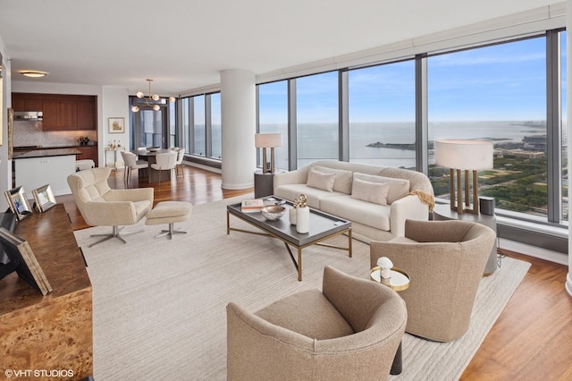 60 E Monroe St Unit 6203, Chicago, IL 60603 - living room with a chandelier, light wood-type flooring, and a water view