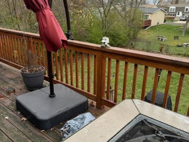 wooden terrace with a yard