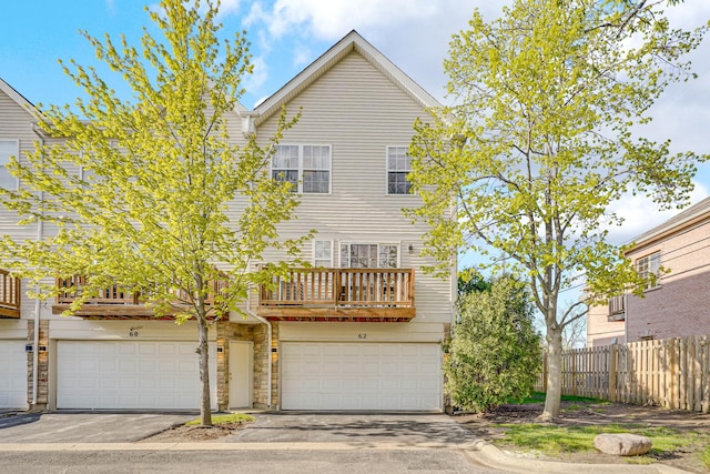 62 E Emma Ct, Palatine, IL 60067 - view of front of house with a balcony, fence, an attached garage, and stone siding