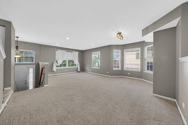 62 E Emma Ct, Palatine, IL 60067 - unfurnished living room featuring baseboards, carpet flooring, and recessed lighting