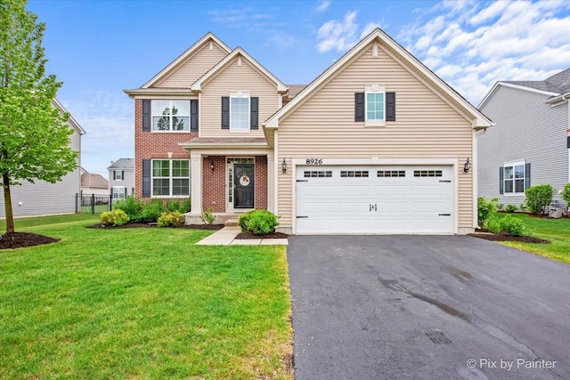 8926 Cook Way, Huntley, IL 60142 - traditional-style home featuring driveway, an attached garage, and brick siding