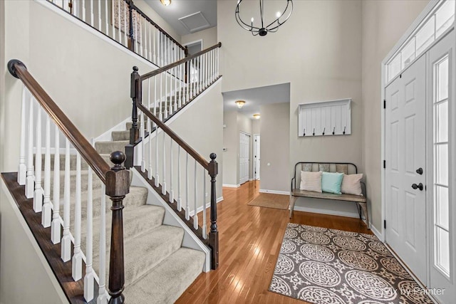 8926 Cook Way, Huntley, IL 60142 - entryway with hardwood / wood-style flooring, a towering ceiling, baseboards, and stairway