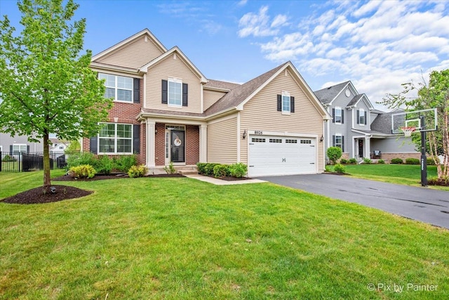 8926 Cook Way, Huntley, IL 60142 - traditional home with a garage, asphalt driveway, and brick siding
