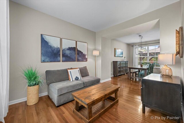 8926 Cook Way, Huntley, IL 60142 - living room featuring baseboards and wood finished floors