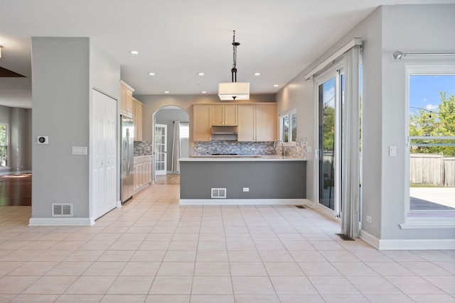 9231 N Natchez Ave, Morton Grove, IL 60053 - kitchen featuring stainless steel refrigerator, arched walkways, light brown cabinets, backsplash, and recessed lighting