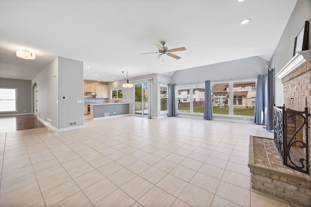 9231 N Natchez Ave, Morton Grove, IL 60053 - unfurnished living room with healthy amount of natural light, ceiling fan, light tile patterned floors, baseboards, and recessed lighting